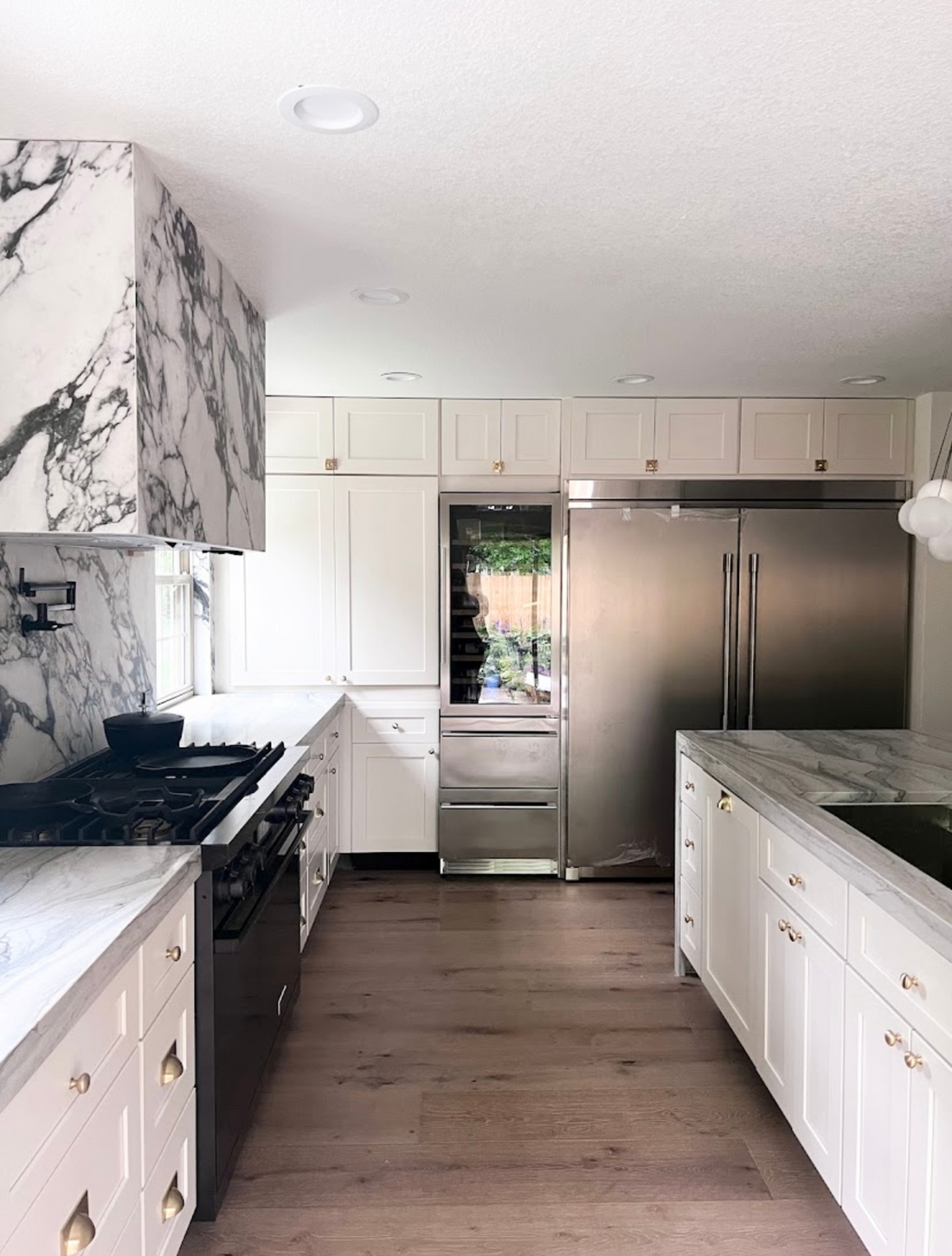Libertyville Kitchen, white shaker kitchen, Ktchen remodel, Natural lighting, Glass Cabinetry, Glass uppers, Spice Rack,