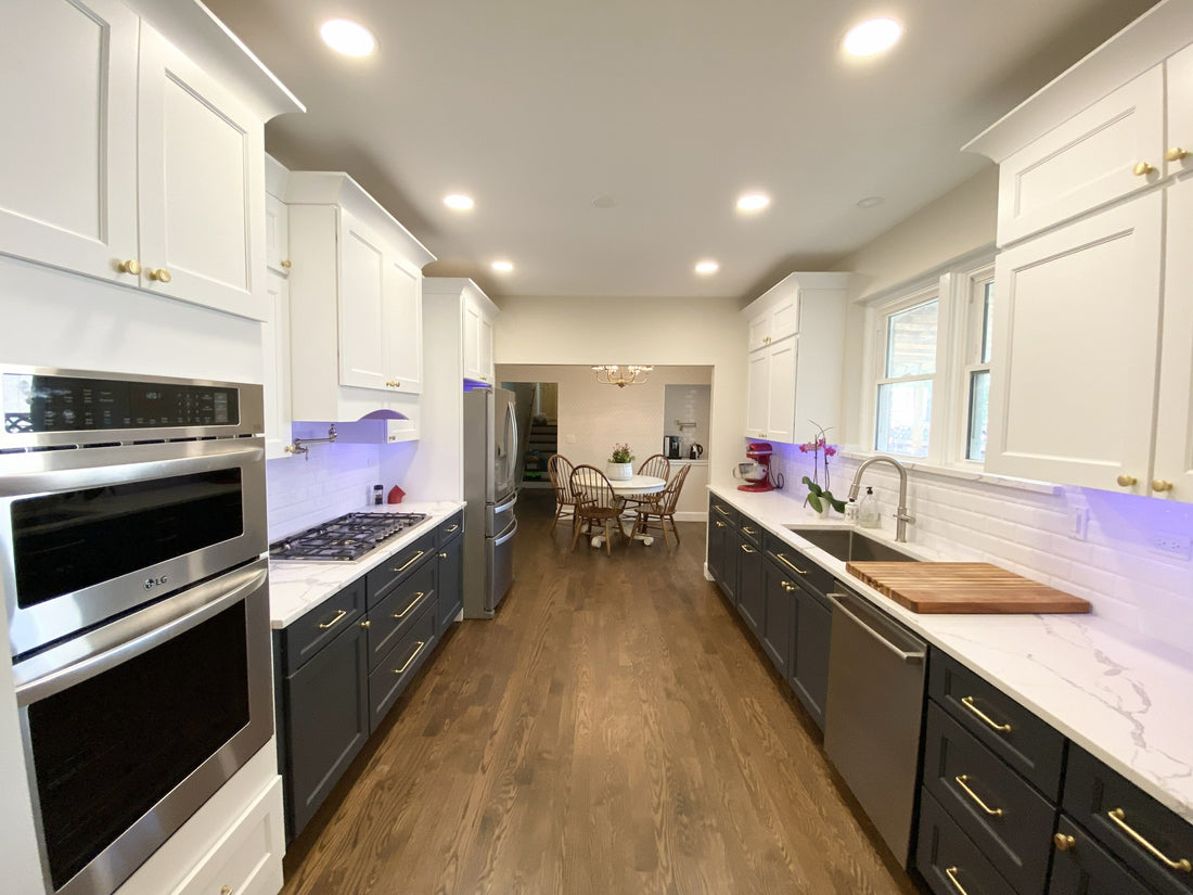Evanston Illinois kitchen remodel before and after — navy lower cabinets, white upper cabinets, quartz countertops, subway tile backsplash, and coffee nook by Lotus Home Improvement Grayslake IL