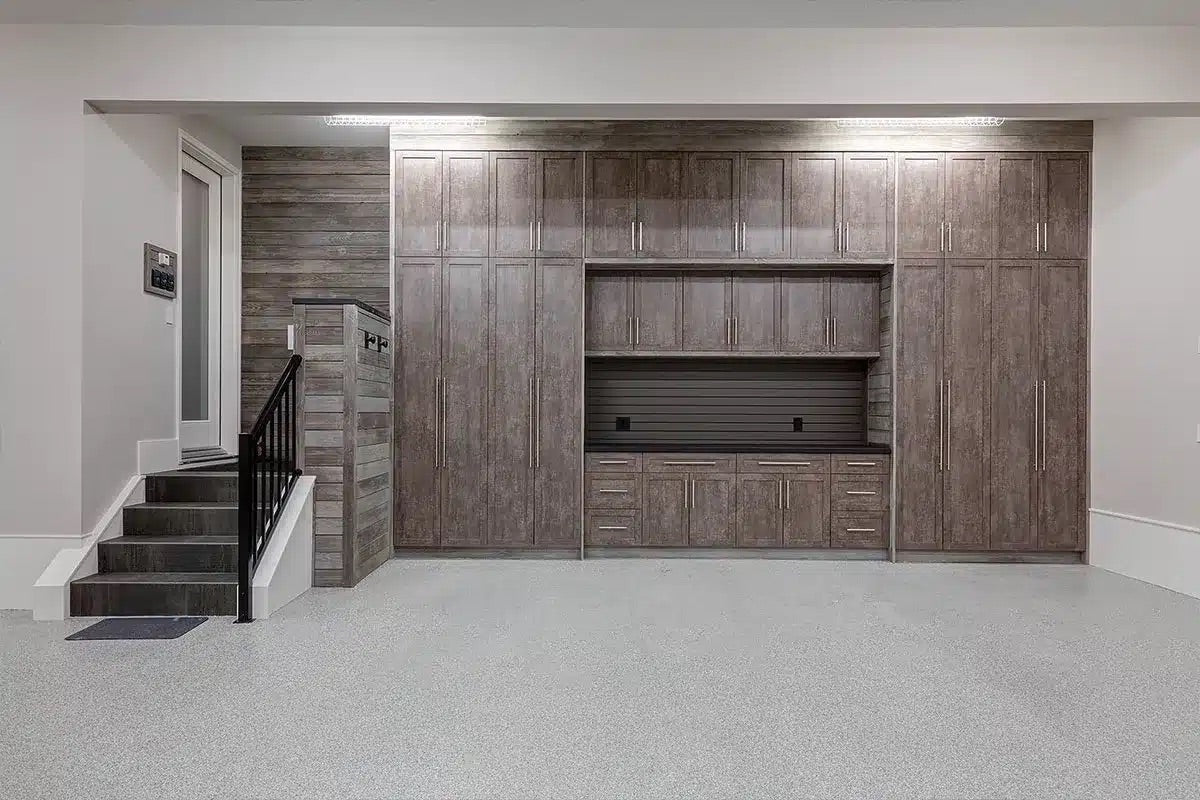 Basement with wooden cabinets and a staircase