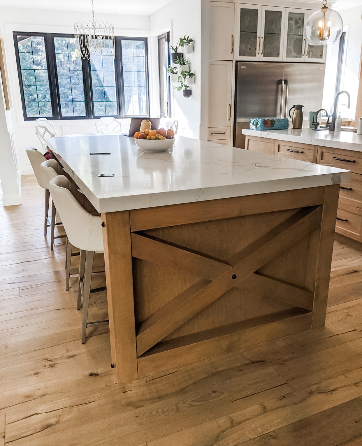 Modern kitchen with wooden island and white countertop