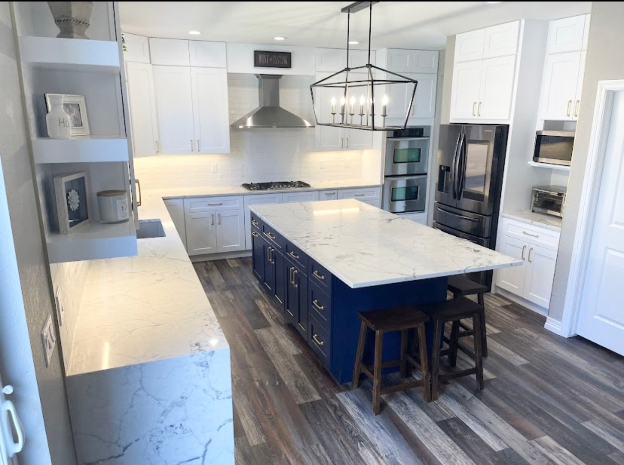 Modern kitchen with marble island and stainless steel appliances